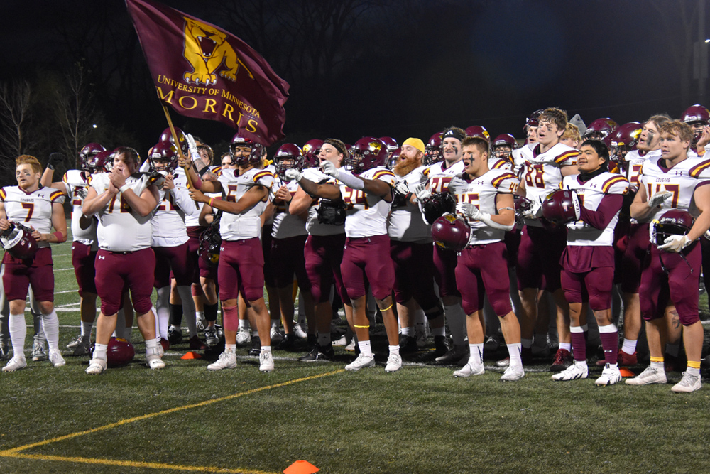 Team Holding Flag Standing